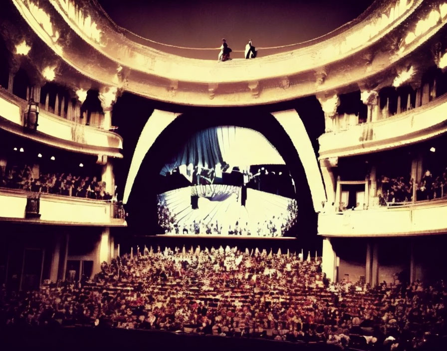 Grand theater with multiple balconies and large stage.