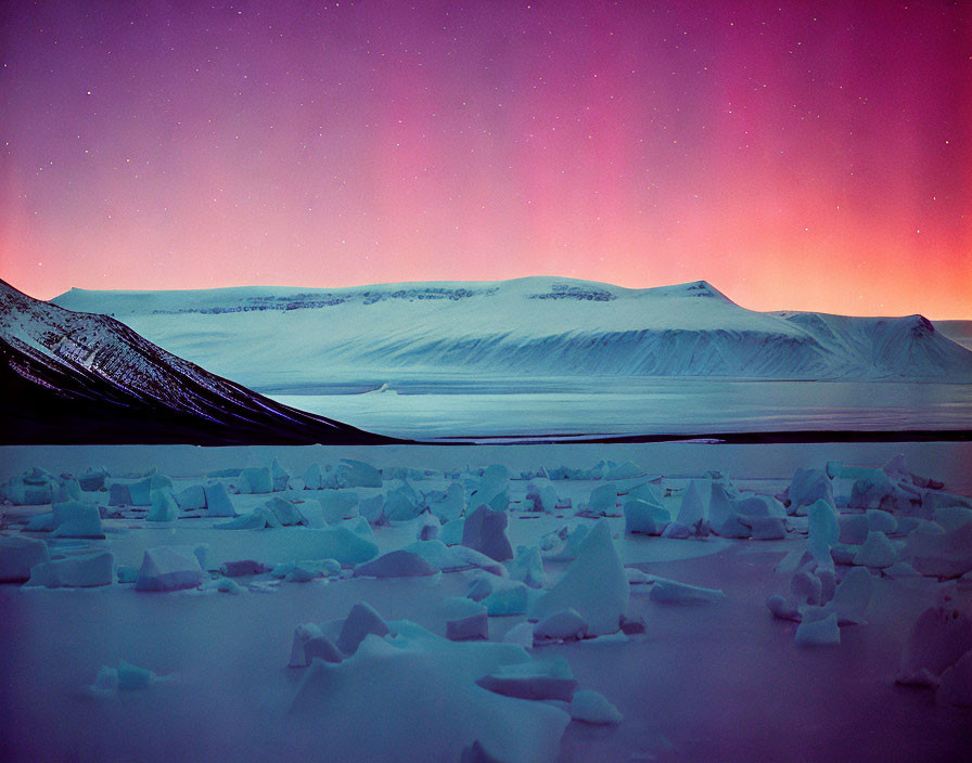 Snow-covered mountain and twilight sky in tranquil Arctic scene