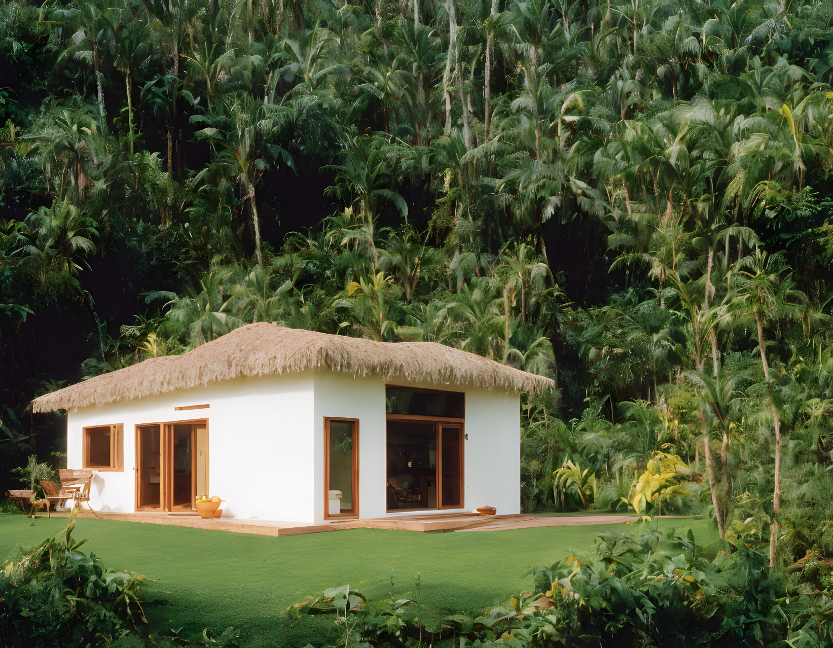 White Thatched Roof Cottage in Lush Palm Forest