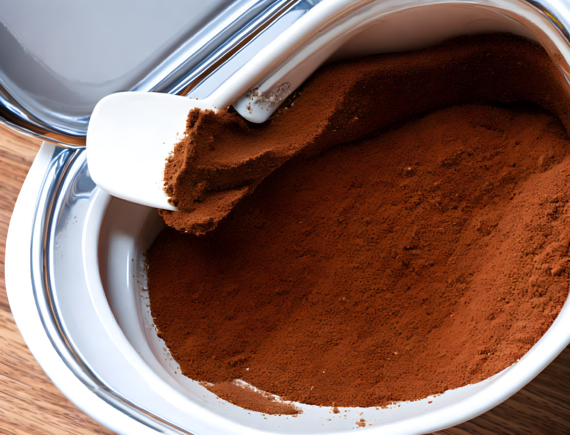 Brown Powder in Container with White Scoop