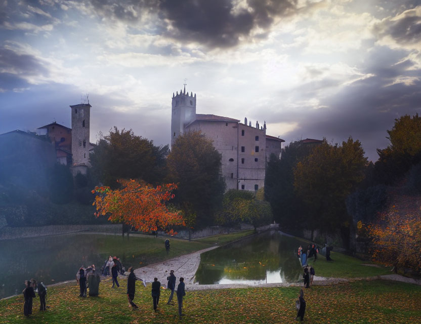 Historic castle at dusk with dramatic clouds, reflective pond, and autumnal garden.