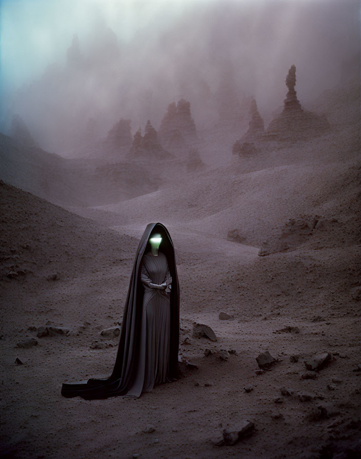 Hooded figure with glowing green light in misty alien landscape