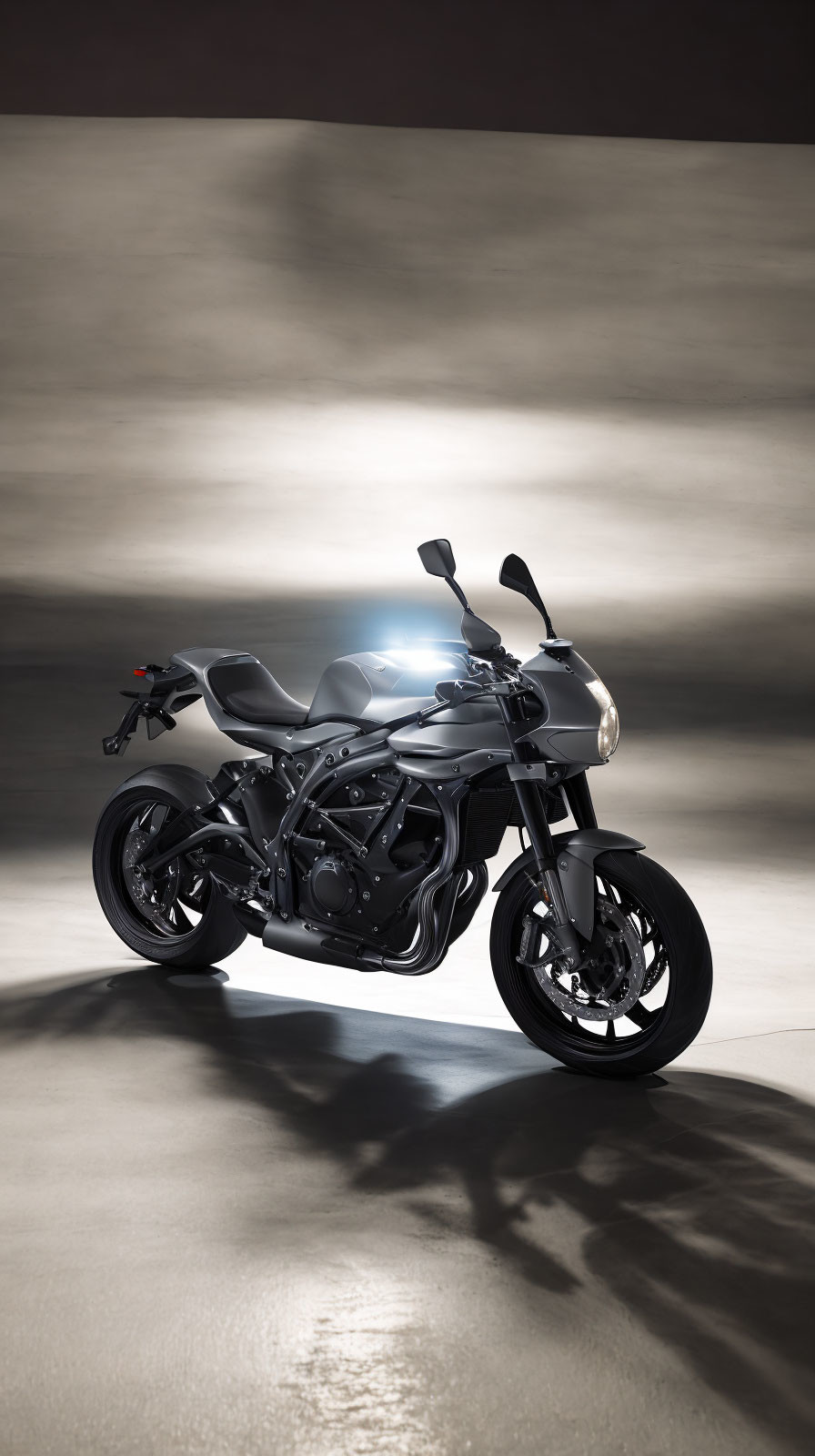 Black sports motorcycle in studio with dramatic lighting