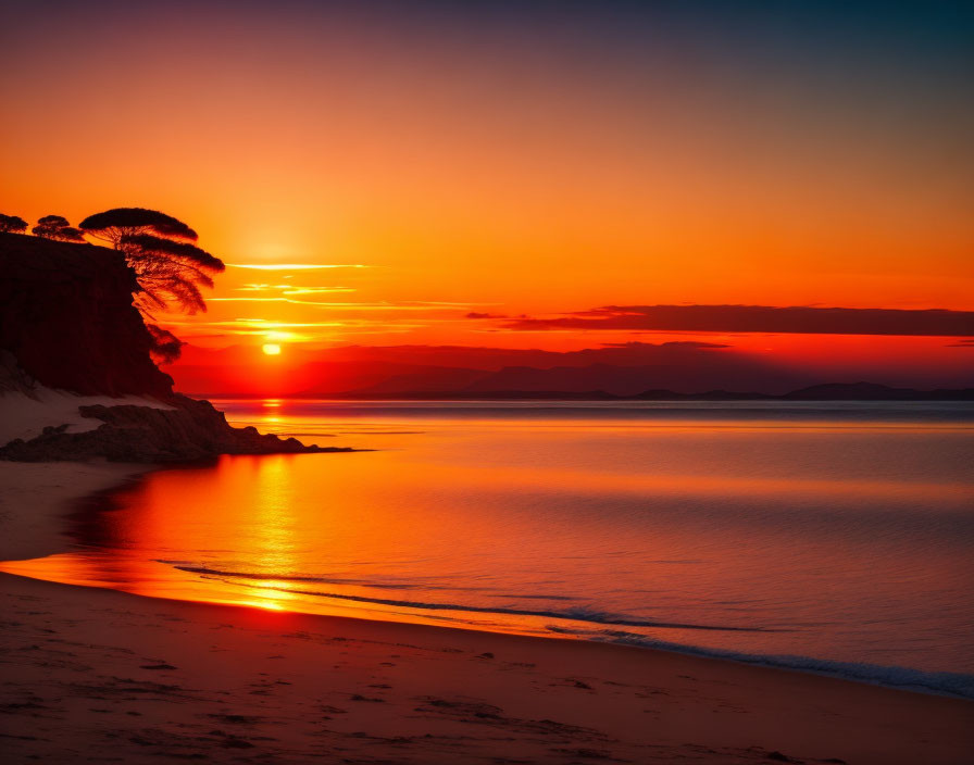 Vibrant orange sunset over ocean with silhouetted cliff, palm trees, and calm water