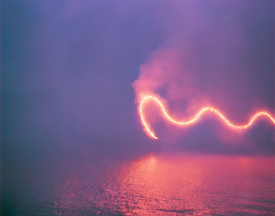 Colorful pink and blue mist with glowing red line on reflective surface