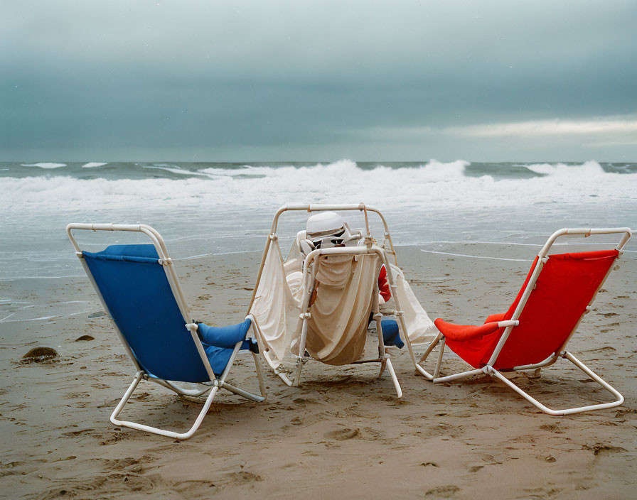 Stormy Beach Scene with Colorful Chairs and Overcast Sky