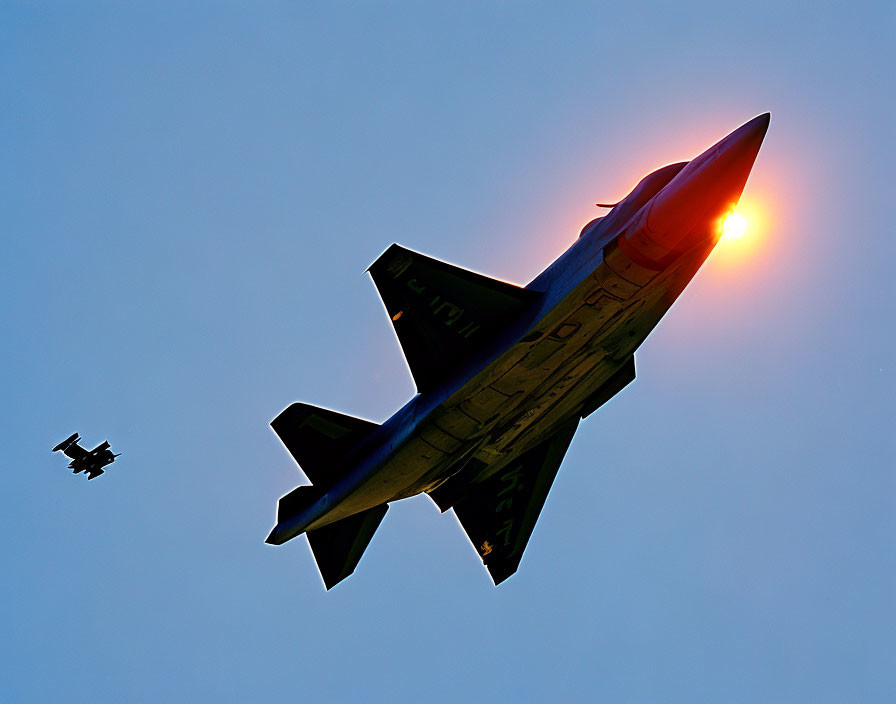 Silhouetted fighter jet with halo effect in sky.