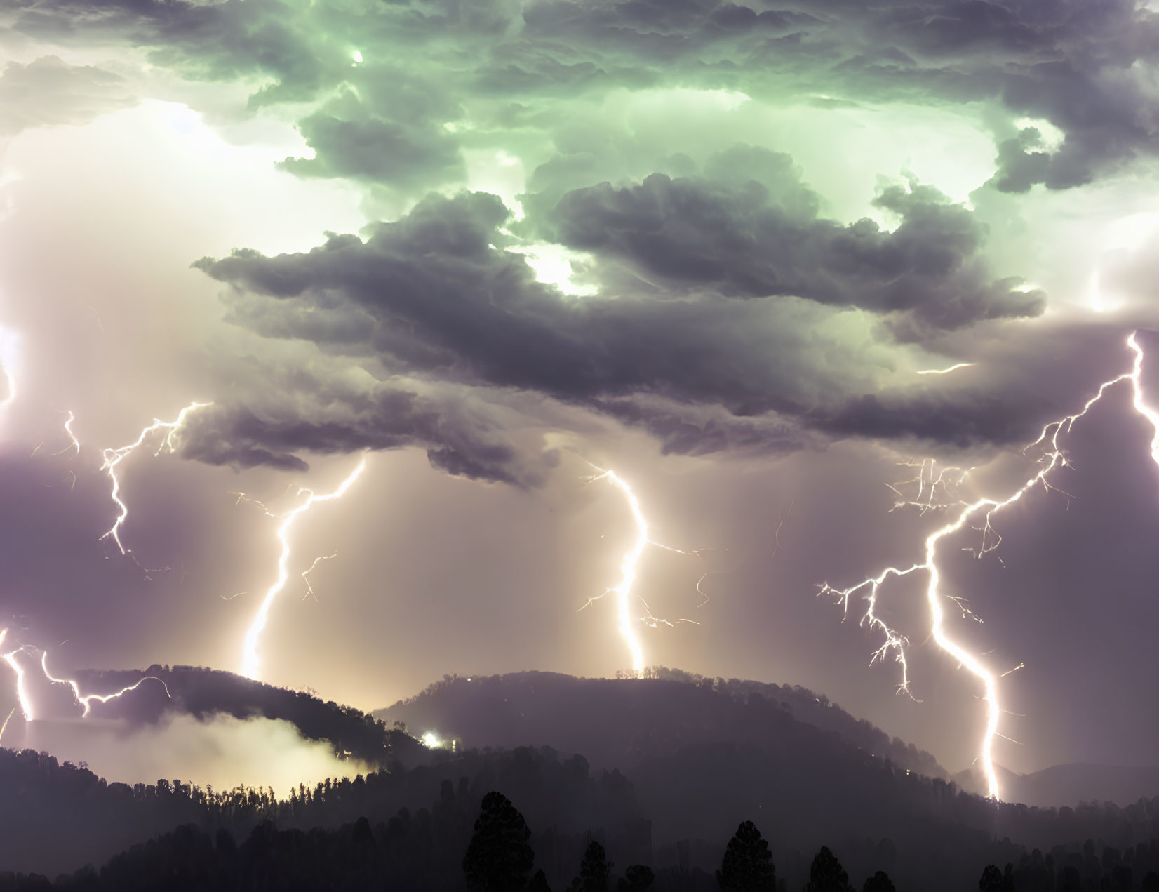 Thunderstorm with Multiple Lightning Strikes Over Forest