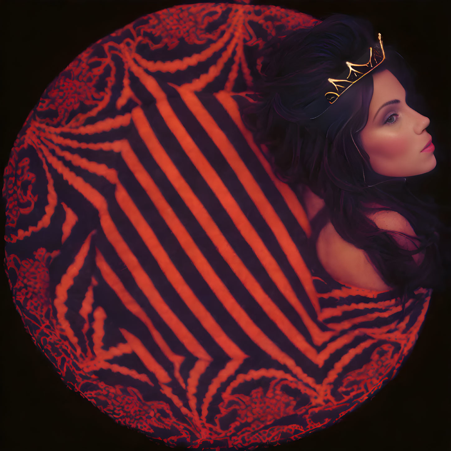 Woman with Crown in Circular Frame Surrounded by Red and Orange Glowing Patterns