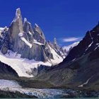 Moonlit Night Over Jagged Peaks with Starry Sky