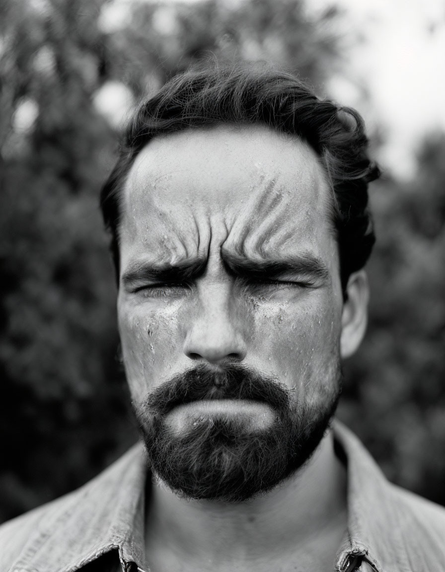 Monochrome portrait of serious bearded man