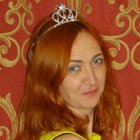 Young woman with auburn hair and gold crown in digital portrait