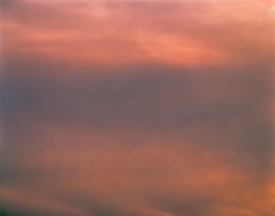 Blurred orange and pink sky at sunset or sunrise