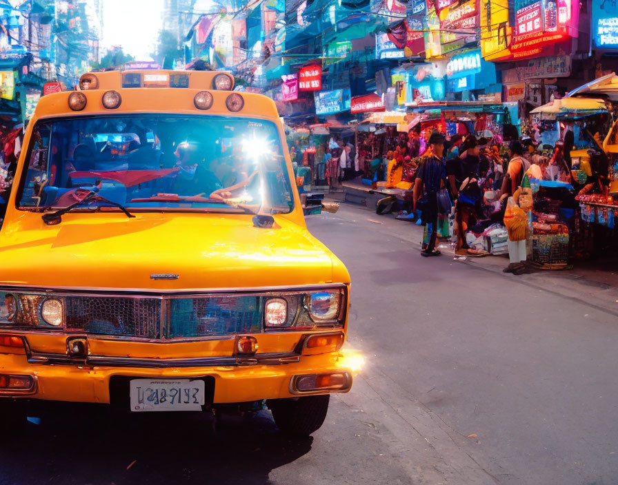 Vibrant neon signs and crowded street with yellow taxi at dusk