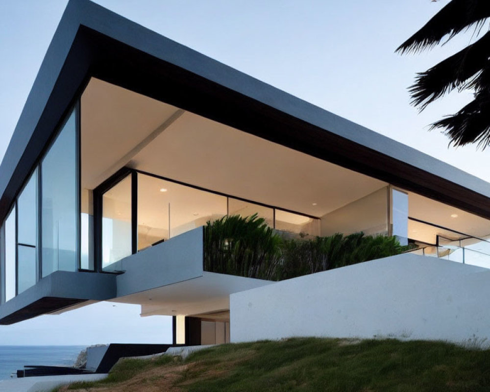 Contemporary cantilevered house with glass walls and sea-view balconies