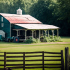 Rustic Green Farmhouse with Porch, Antique Tractor, and Wooden Fence