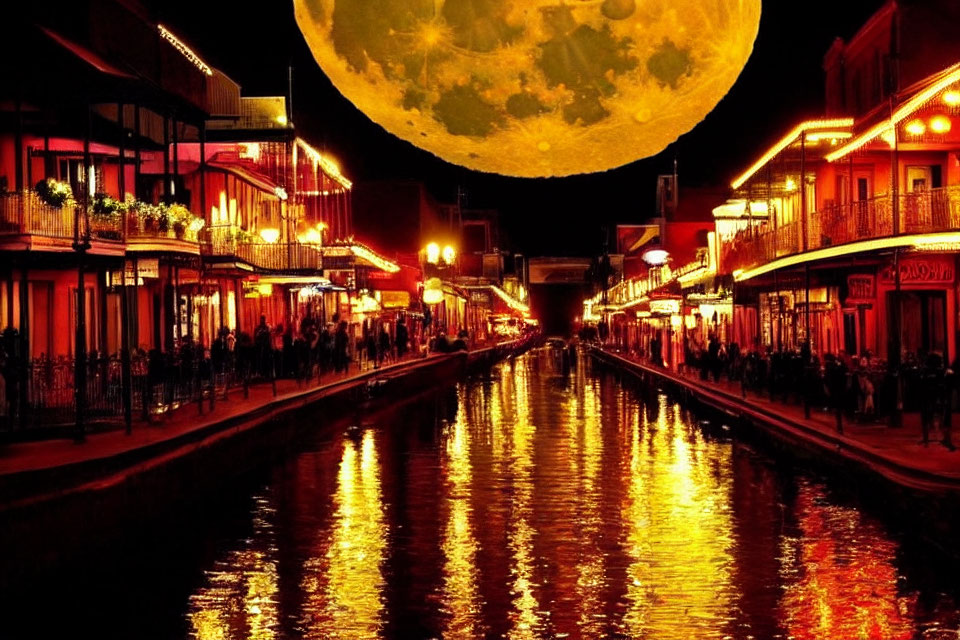 Night cityscape with glowing buildings and full moon above canal