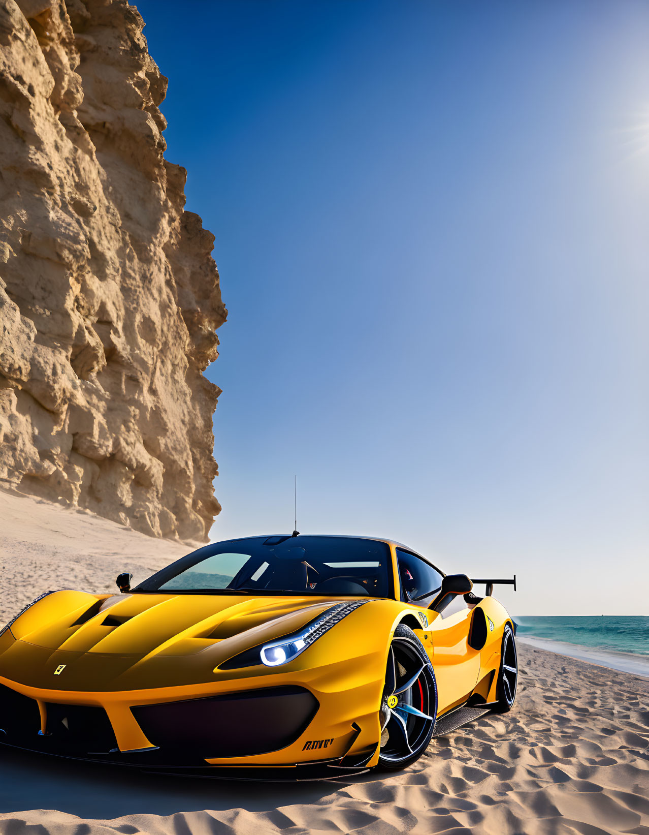 Yellow and Black Sports Car on Sandy Beach with Rock Formation