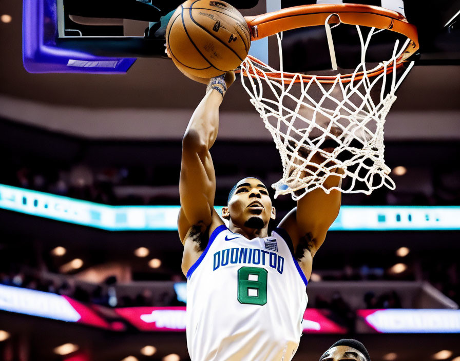 Basketball player in white and green jersey number 8 making a layup in indoor game