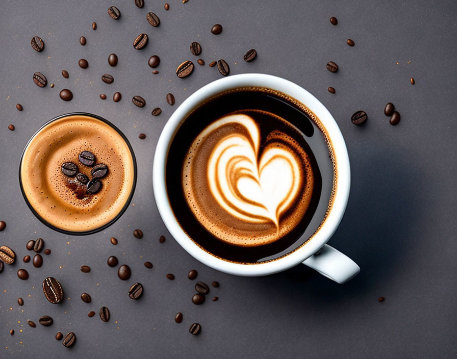 Coffee cup with heart latte art and espresso glass on dark surface.