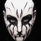 Symmetrical tribal mask with dark eye shadow on black background