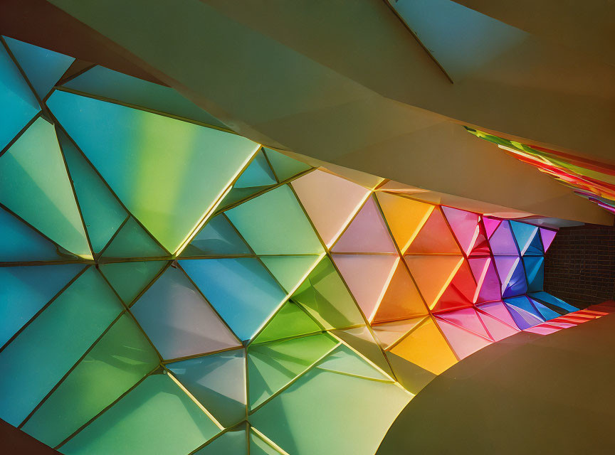 Geometric ceiling with translucent colored panels casting vibrant light