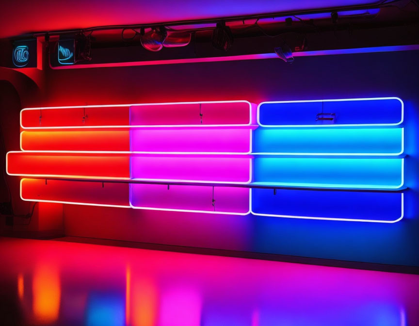 Vibrant neon lights in blue, pink, and red hues on wall