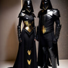 Medieval-inspired black and gold armor on two figures against beige backdrop