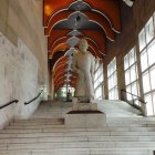 Grand Spiral Staircase and Towering Bookshelves in Enchanting Library