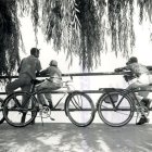 Young Girl and Young Man on Bicycle in Dreamy Setting