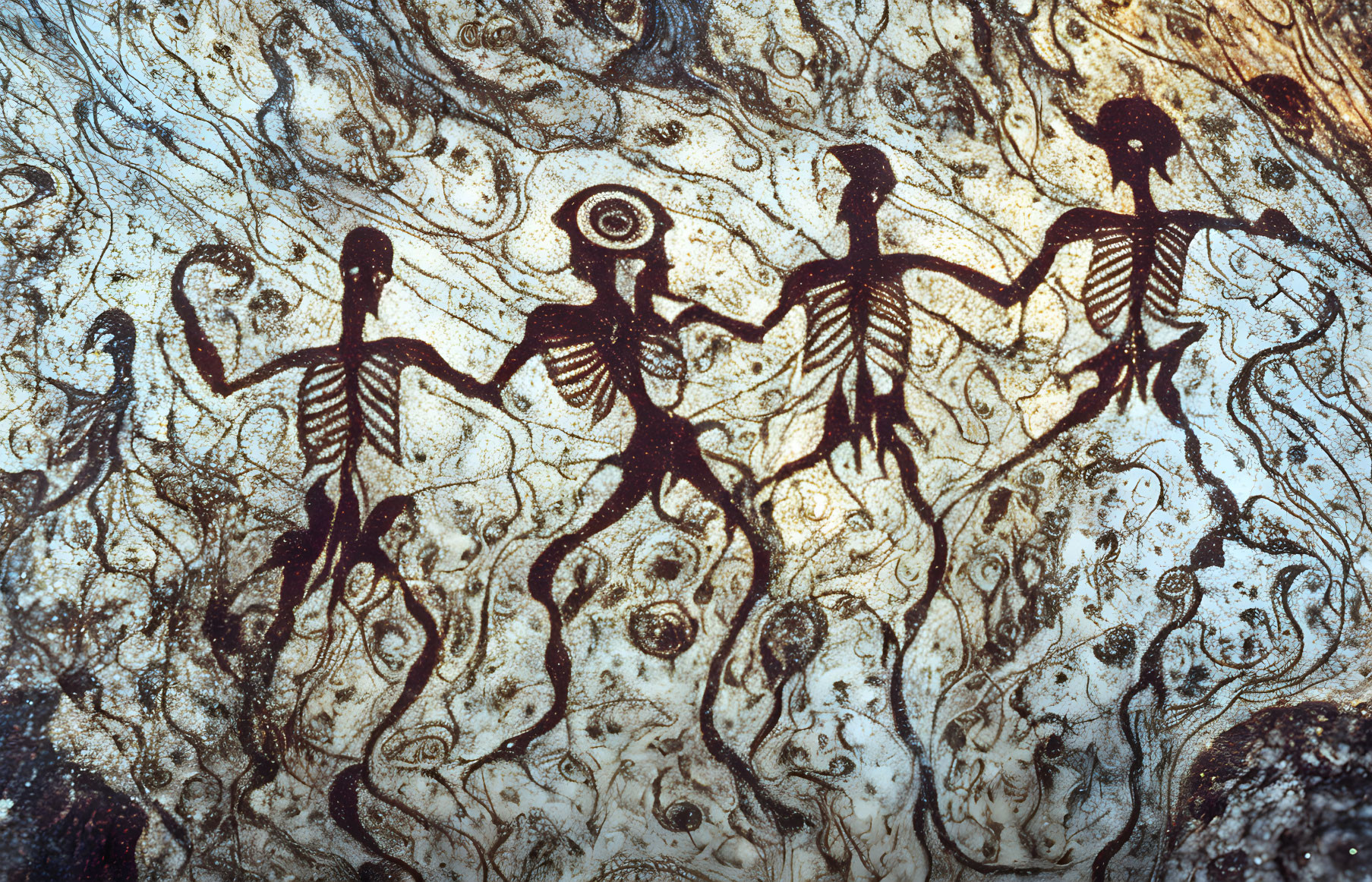 Ancient rock art: Four human figures with decorative bodies in dance or ritual, etched with swirling