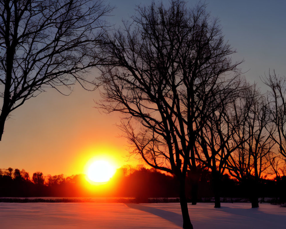 Orange and Purple Sunset Over Snow-Covered Landscape