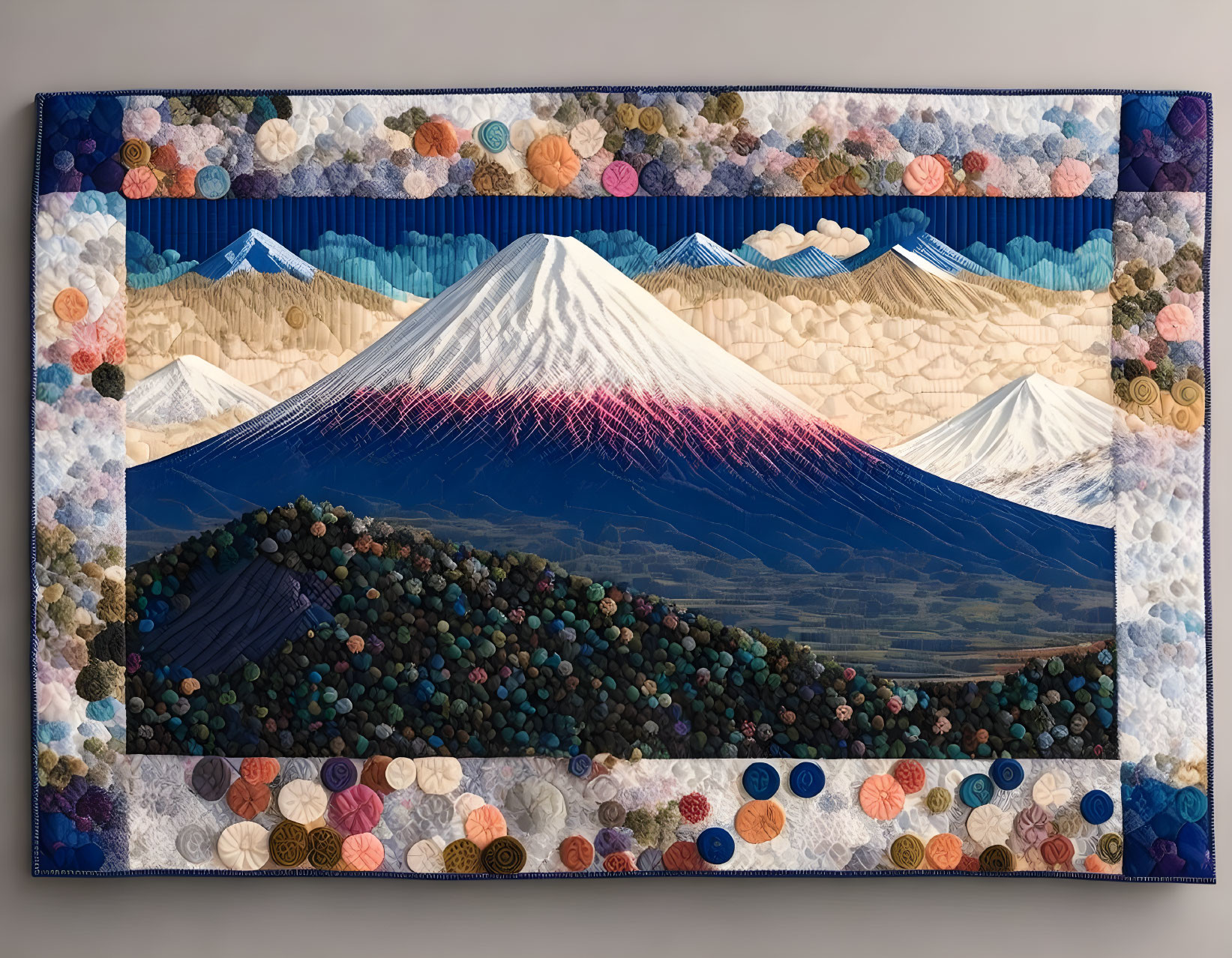 Stylized Mount Fuji textile art with patterned sky and 3D accents