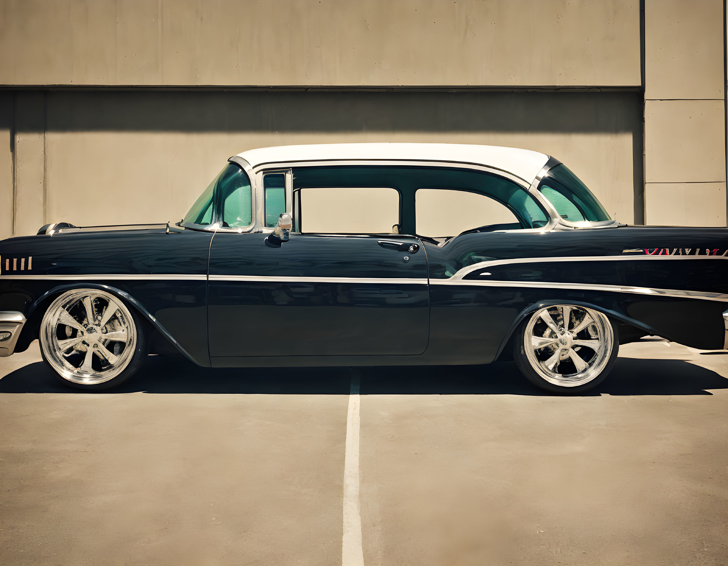 Classic Black Car with White Roof Detailing and Chrome Wheels Parked in Empty Lot