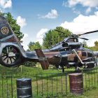 Elaborately Decorated Helicopters on Grass Field