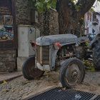 Vintage Tractor in Rustic Farm Setting with Barn in Black and White