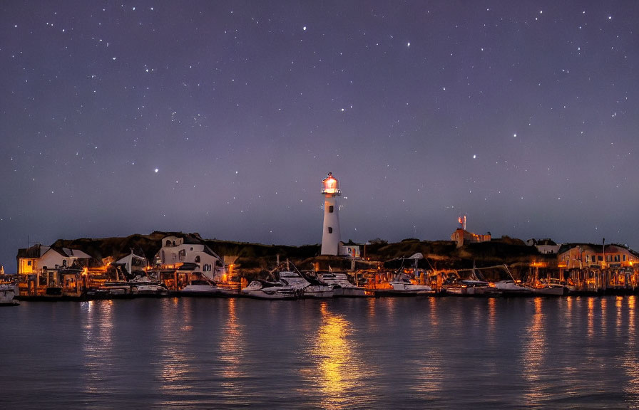 Tranquil harbor scene with lighthouse, boats, and starlit sky