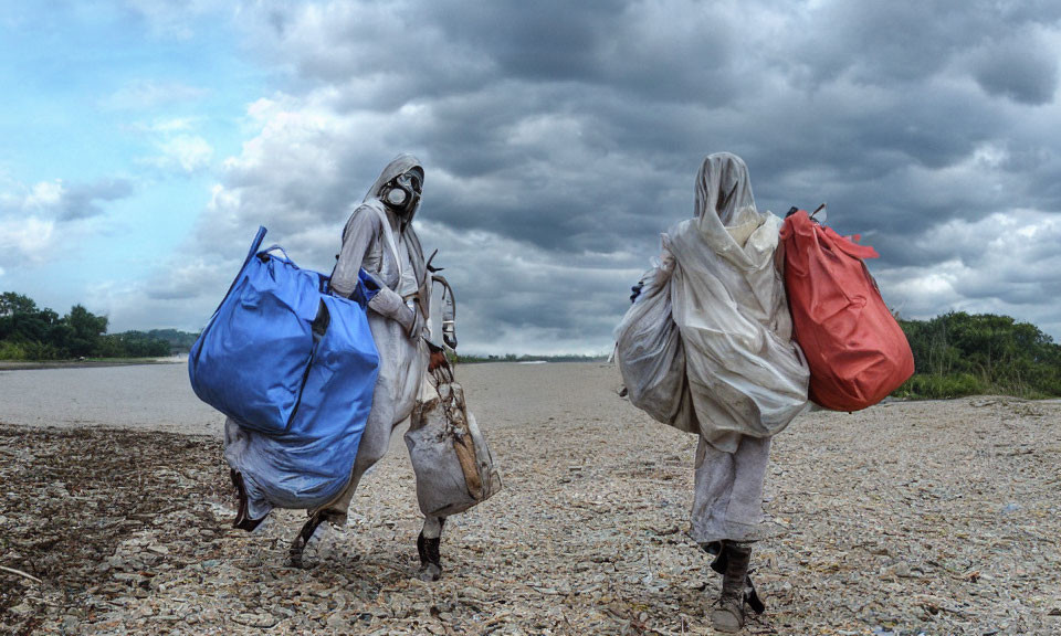 Two people with colorful bags walking by a pebbled riverbank under cloudy sky