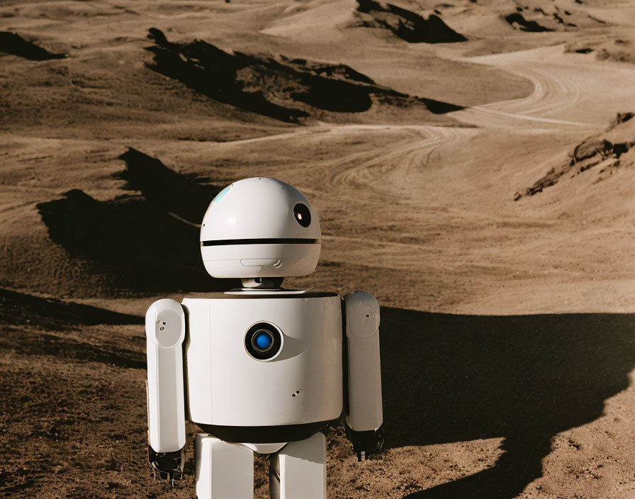 Humanoid Robot in Desert Landscape with Sandy Terrain and Bright Sky