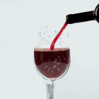 Pouring Red Wine Creates Splash with Cosmic Swirl Pattern