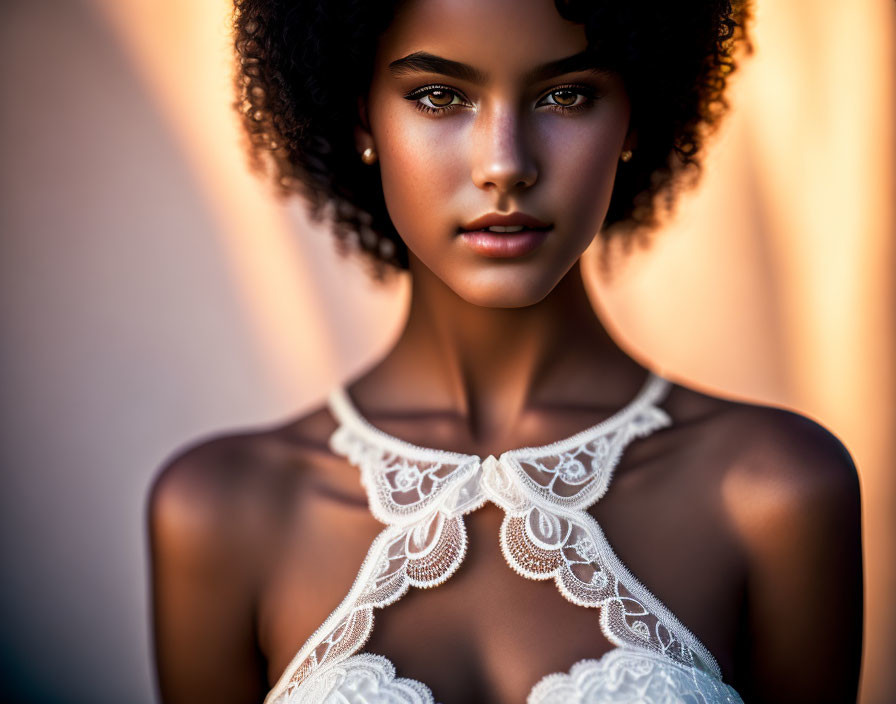 Curly Haired Woman in White Lace Garment with Striking Eyes