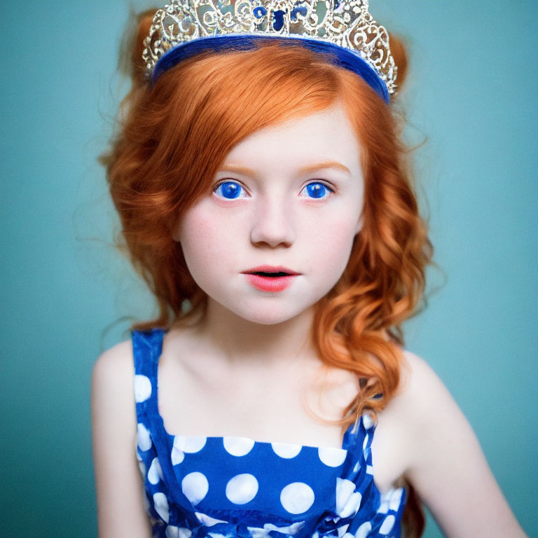 Red-haired girl in crown and blue dress on teal background