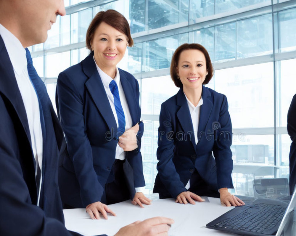 Diverse professionals in modern office meeting.