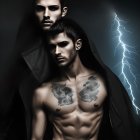 Two men in dark setting: one shirtless, one in a hoodie, with blue flame.