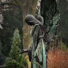 Detailed Angel Statue with Weathered Patina in Woodland Scene