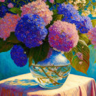 Colorful Hydrangeas in Vase on Table with Patterned Cloth and Blue Background