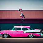 Pink Classic Car with Flamingo Sculpture in Front of Building