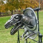 Colorful Dragon Sculpture with Blue Wings in Green Park Setting