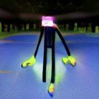 3D rendering: Minecraft Enderman with green glowing blocks in nighttime sandbox