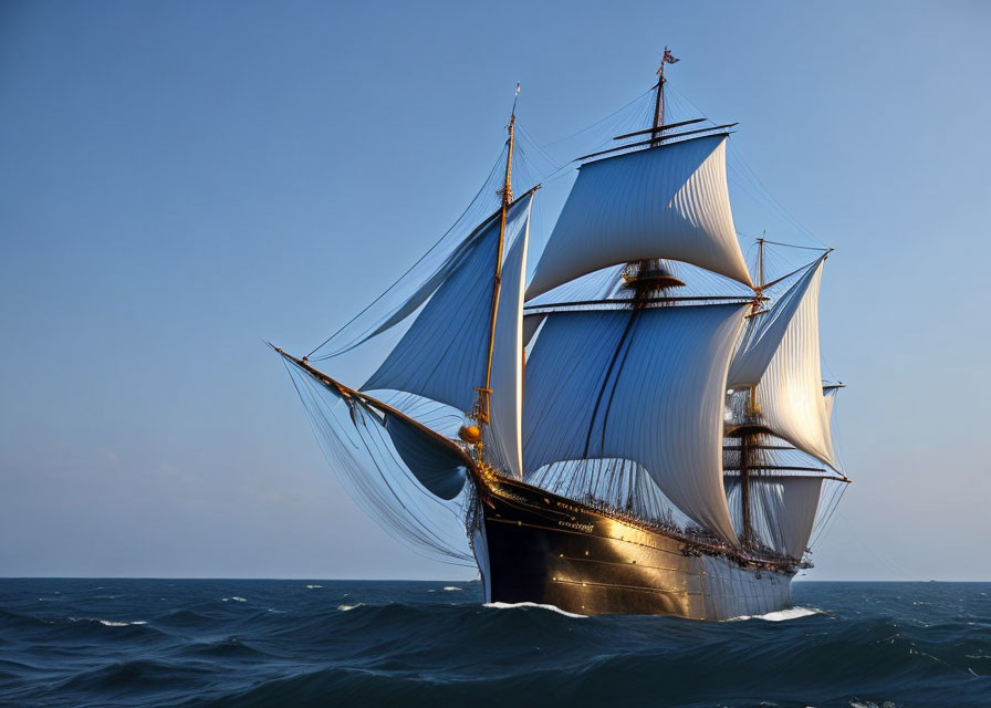 Tall ship with billowing sails on ocean under clear blue sky